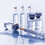 Five vials of clear liquid, varying sizes. One is on its side with a syringe in it.